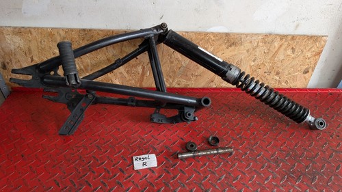 Swingarm strut shock absorber